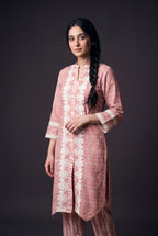 Model wearing the Blush Bandhani Lace Suit, showing the white floral lace down the front