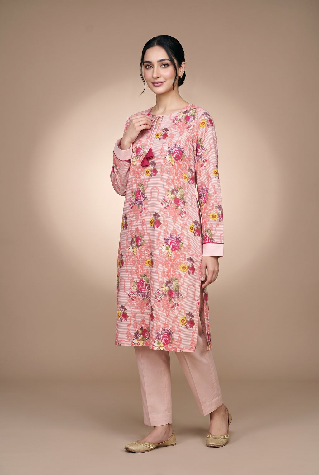 Model wearing the Blush Bouquet Suit in rose pink floral print, full-length front view