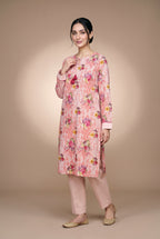 Model wearing the Blush Bouquet Suit in rose pink floral print, full-length front view