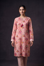 Model wearing the Blush Bouquet Suit, showing the tasselled neck ties and bouquet print