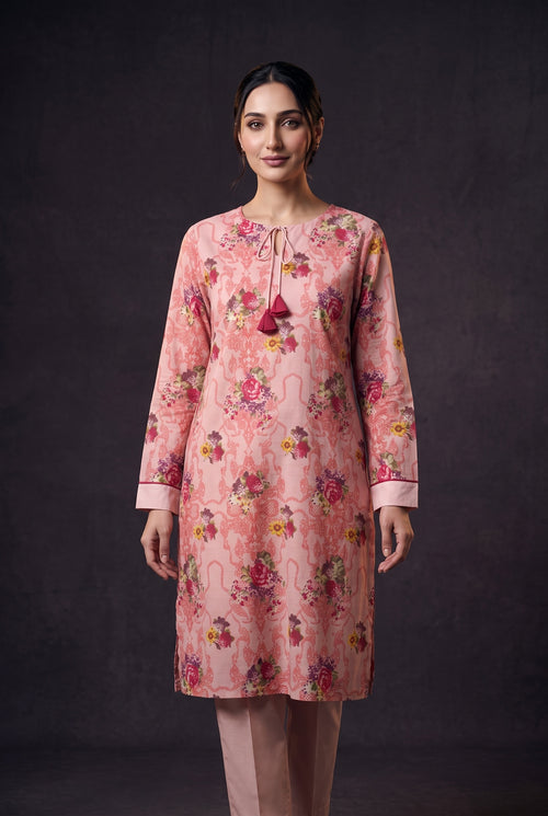 Model wearing the Blush Bouquet Suit, showing the tasselled neck ties and bouquet print