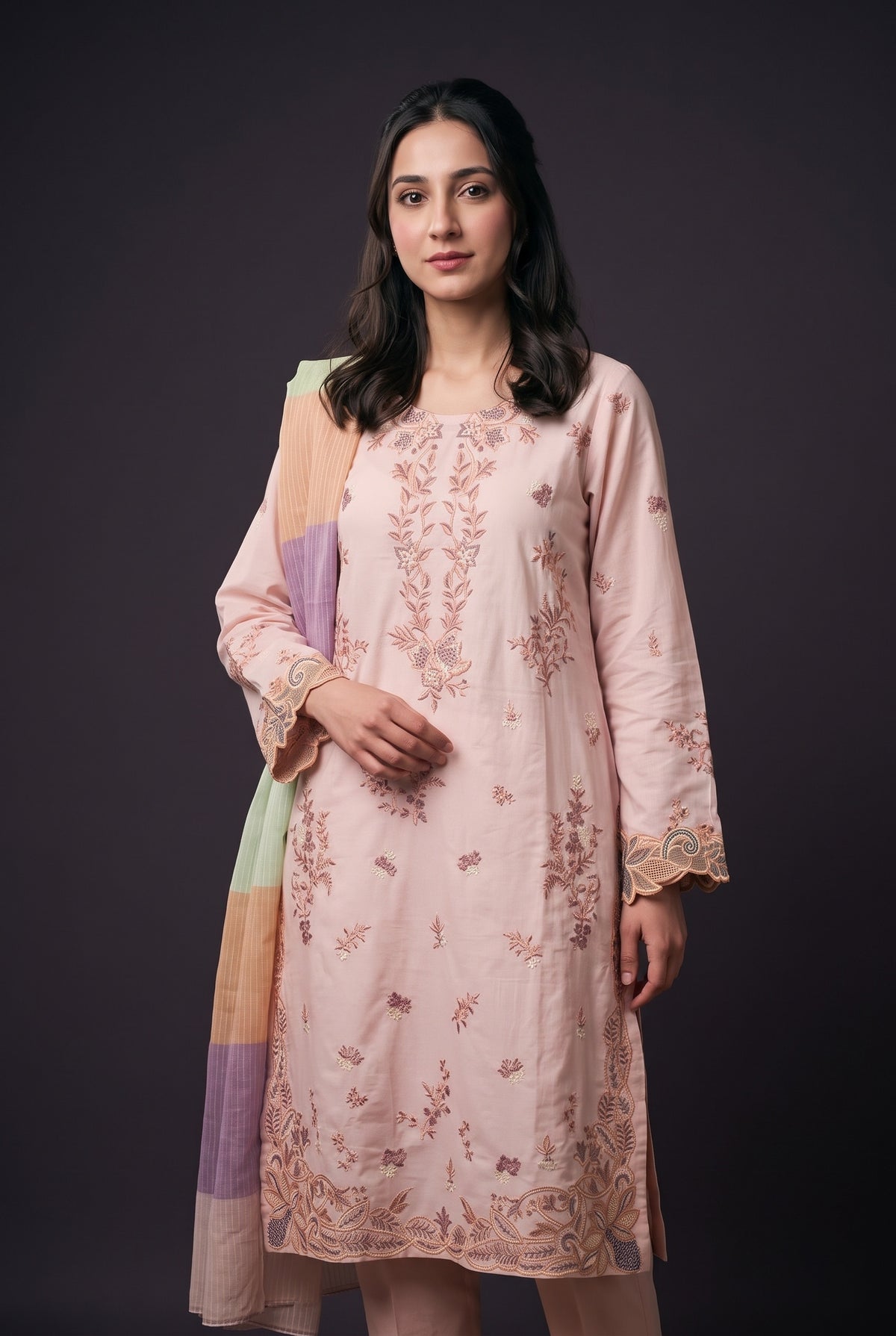 Model wearing the Blush Prism Suit, showing the pastel neckline embroidery and paisley cuffs