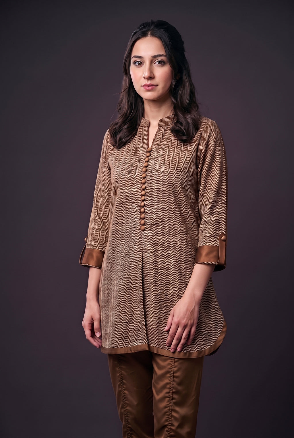 Model wearing the Bronze Herringbone Suit, showing the covered buttons and bronze cuffs