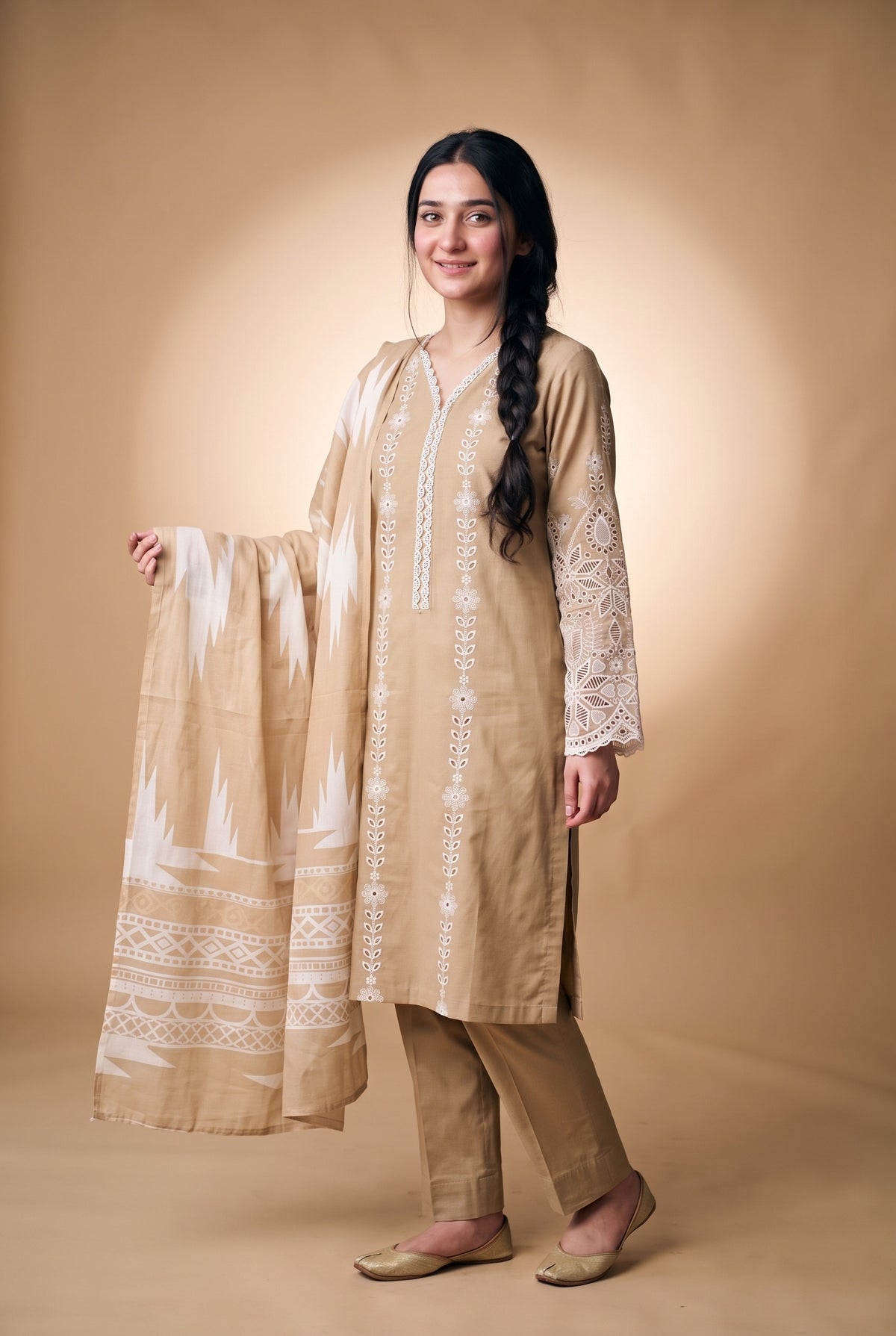Model wearing the Fawn Eyelet Suit in fawn beige, full-length view holding the printed dupatta