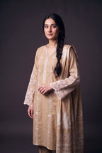 Model wearing the Fawn Eyelet Suit, showing the lace-trimmed neckline and white cutwork sleeves
