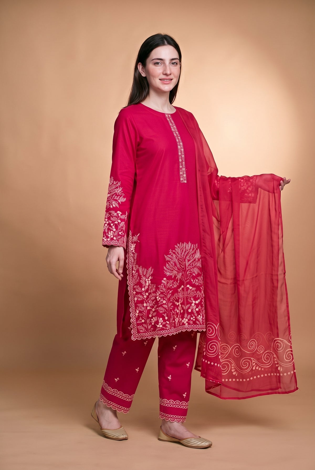 Model wearing the Blossom Tree Suit in fuchsia, full-length front view with the sheer dupatta