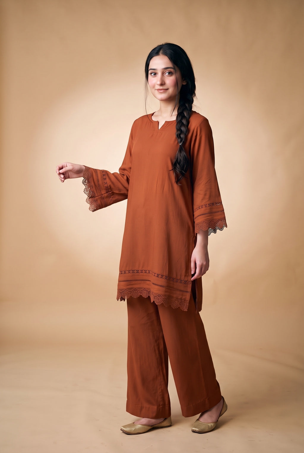 Model wearing the Lace Trim Suit in rust, full-length view with wide-leg trousers