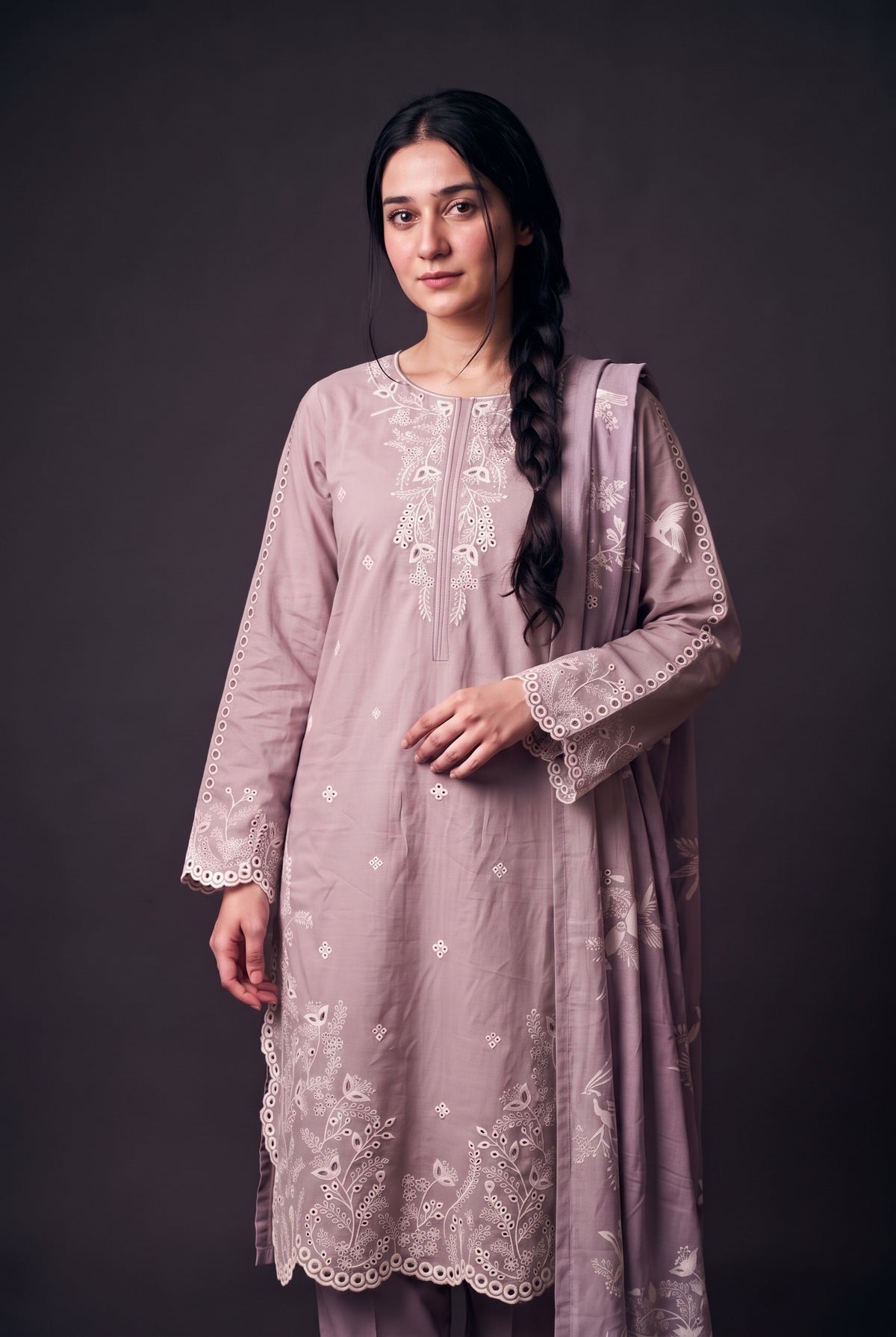 Model wearing the Lavender Eyelet Suit, showing the eyelet yoke and scalloped sleeves