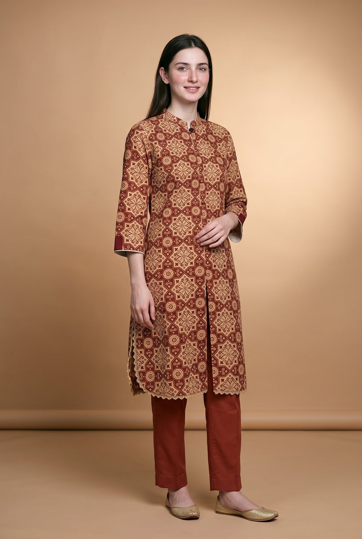 Model wearing the Maroon Star Tile Suit in maroon and beige print with brick red trousers, full-length front view