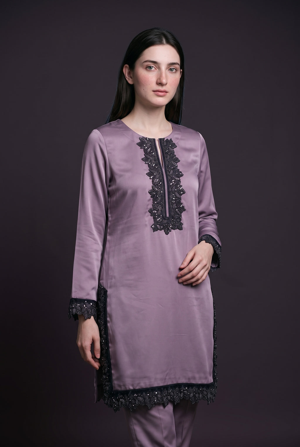 Model wearing the Mauve Noir Lace Suit, showing the beaded lace neckline panel
