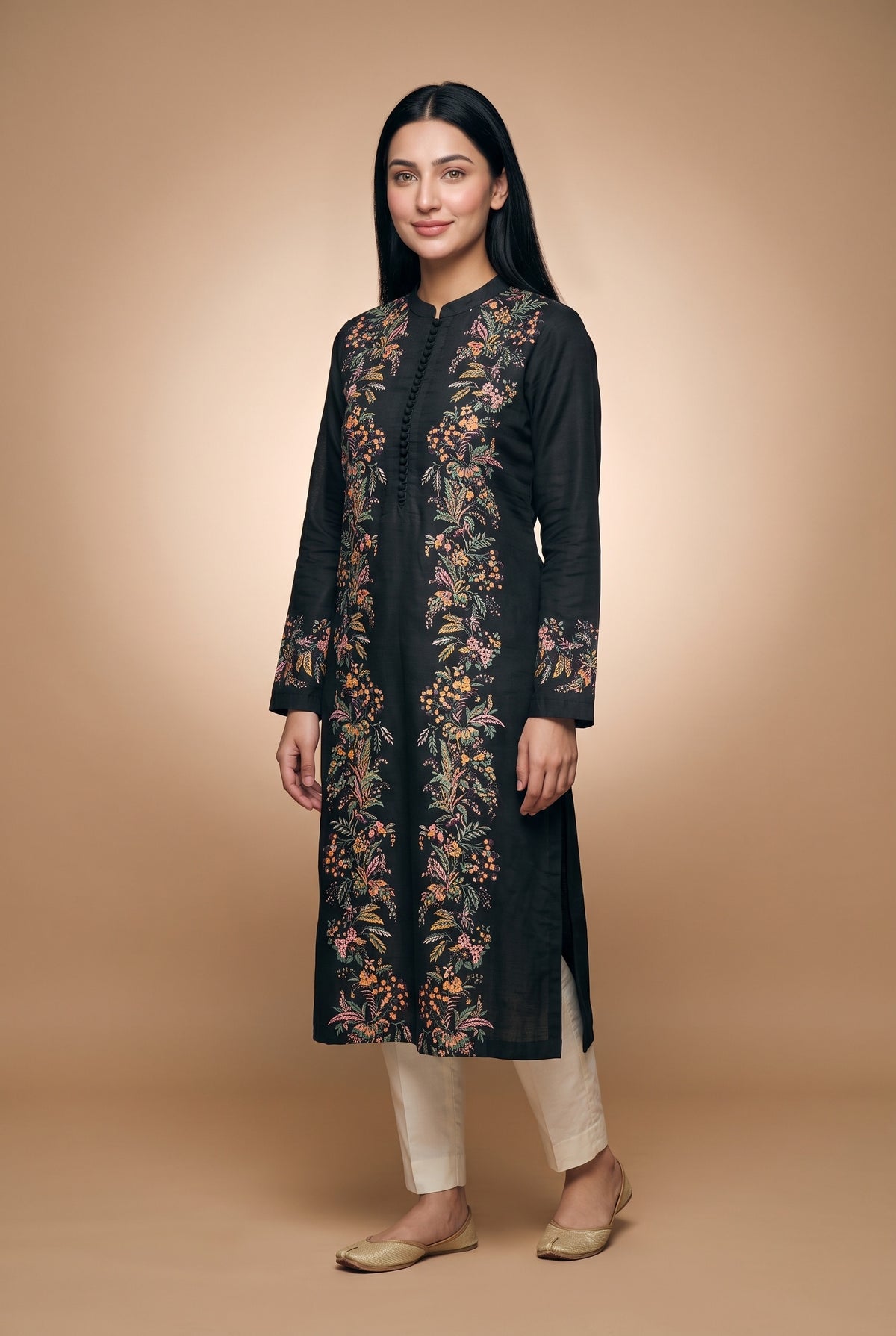 Model wearing the Garland Kurta in black with plain cream trousers (not included), full-length front view