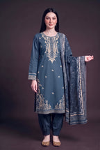 Model wearing the Midnight Paisley Suit, showing the ivory paisley neckline and embroidered hem