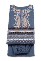 Midnight Paisley Suit folded to show the paisley neckline, with the printed-border dupatta and trousers
