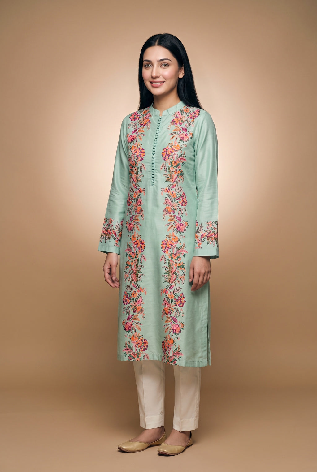 Model wearing the Garland Kurta in mint with plain cream trousers (not included), full-length front view