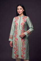 Model wearing the Garland Kurta in mint, showing the mandarin collar and printed floral panels