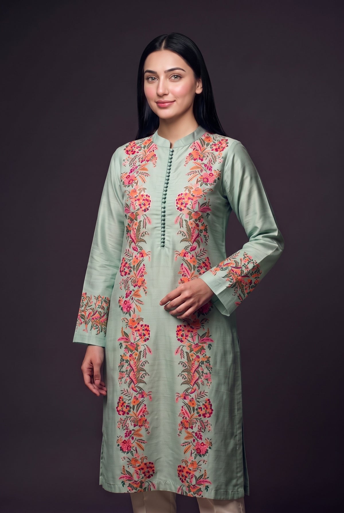 Model wearing the Garland Kurta in mint, showing the mandarin collar and printed floral panels