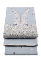 Misty Blue Cutwork Suit folded to show the neckline embroidery and cutwork border, with dupatta and trousers