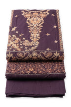 Mulberry Gilded Suit folded to show the embroidered yoke and hem panel, with the paisley dupatta and trousers