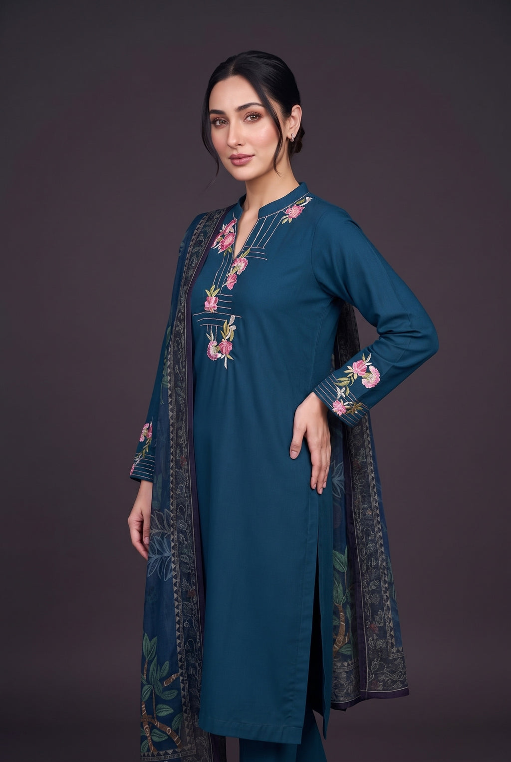 Model wearing the Peacock Carnation Suit, showing the carnation embroidery at the neckline and cuffs