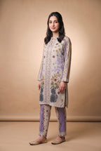 Model wearing the Pineapple Garden Suit in stone grey print, full-length view with matching printed trousers