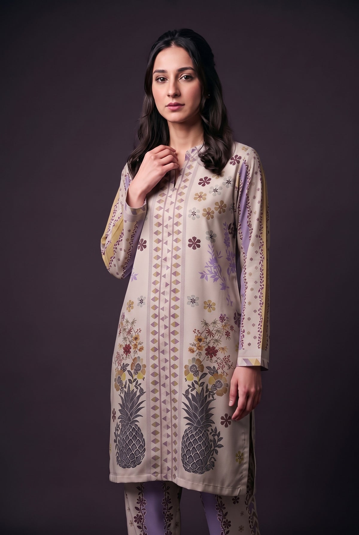 Model wearing the Pineapple Garden Suit, showing the band collar and pineapple print