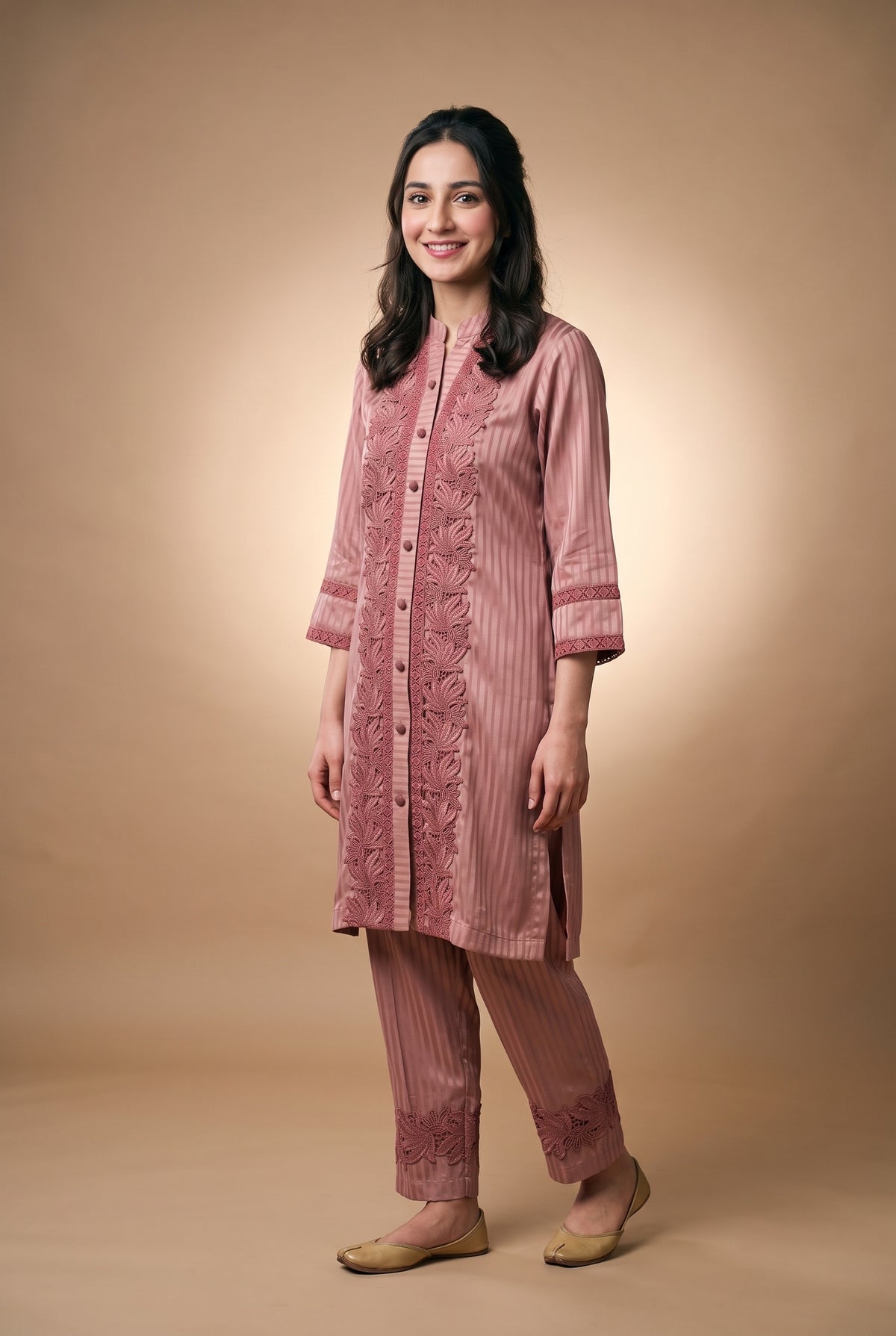 Model wearing the Rose Lotus Lace Suit in dusty rose, full-length front view with lace-trimmed trousers