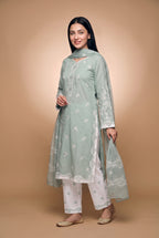 Model wearing the Sage Scallop Eyelet Suit in sage green with off-white trousers, full-length front view with the dupatta